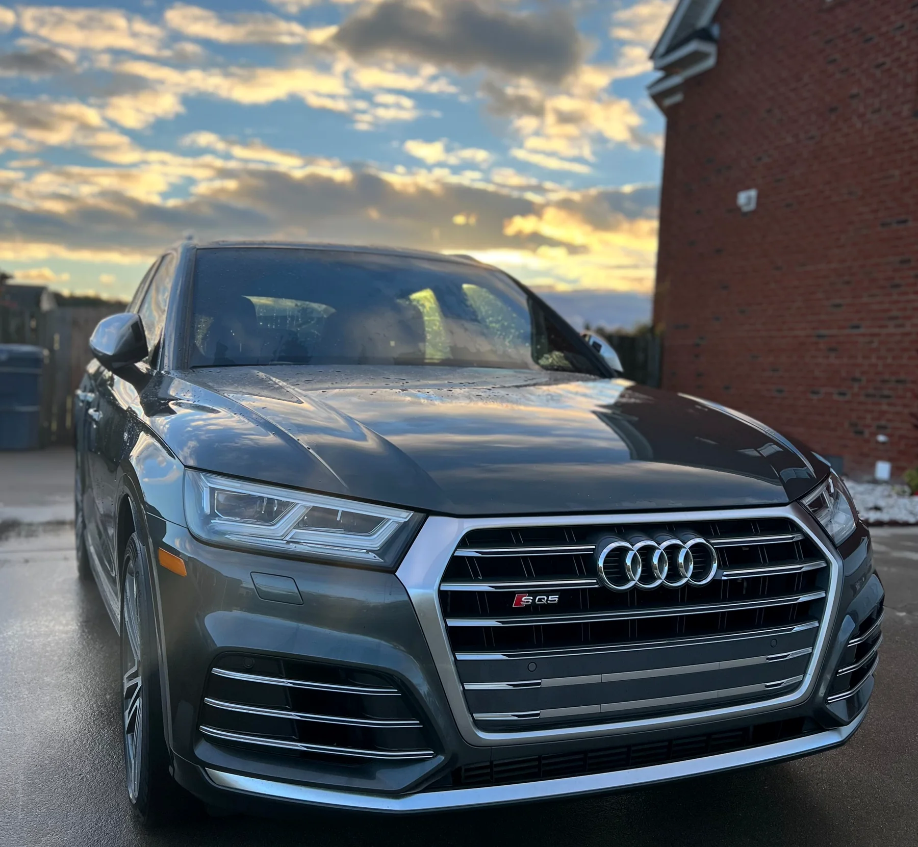 Clean Audi SUV outside at sunset after a detail