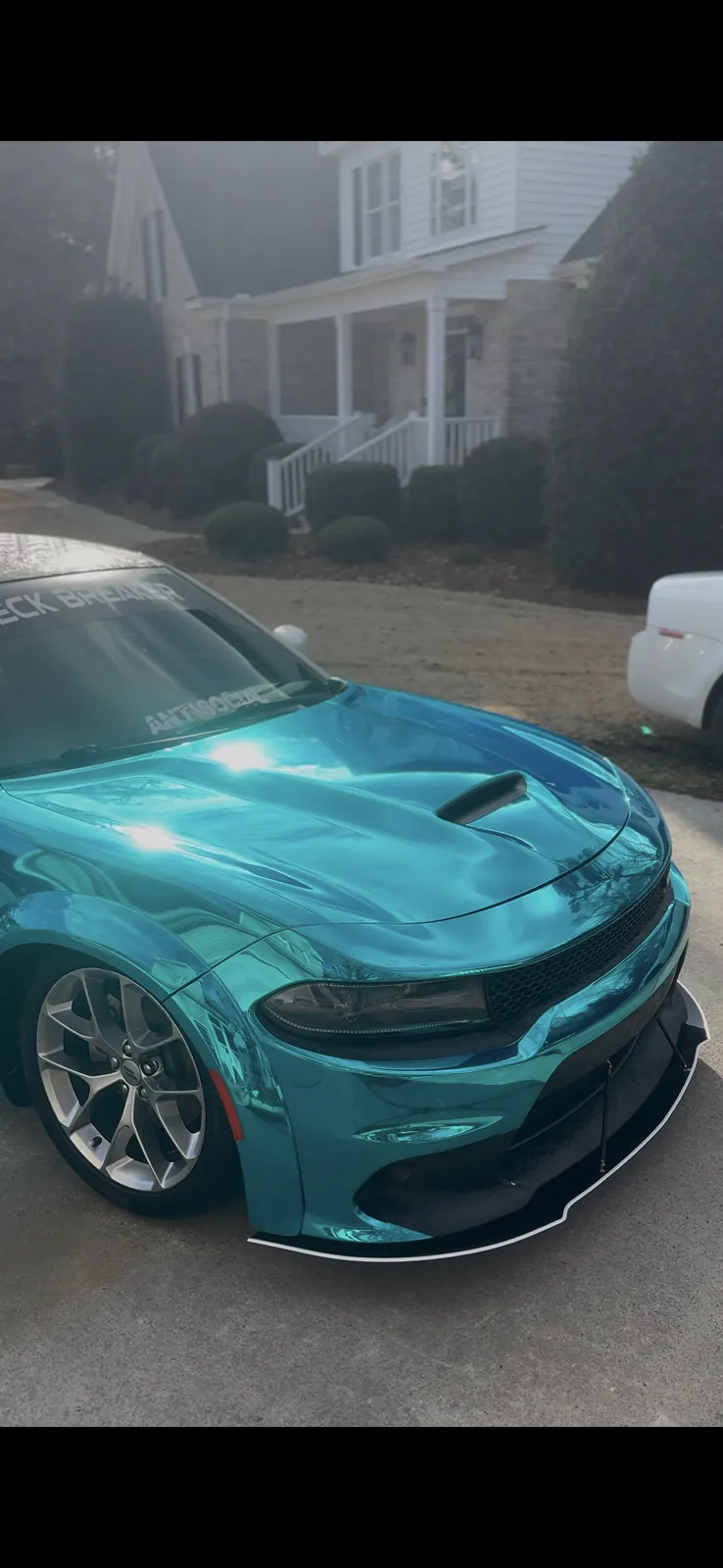 Close view of the polished teal Charger exterior