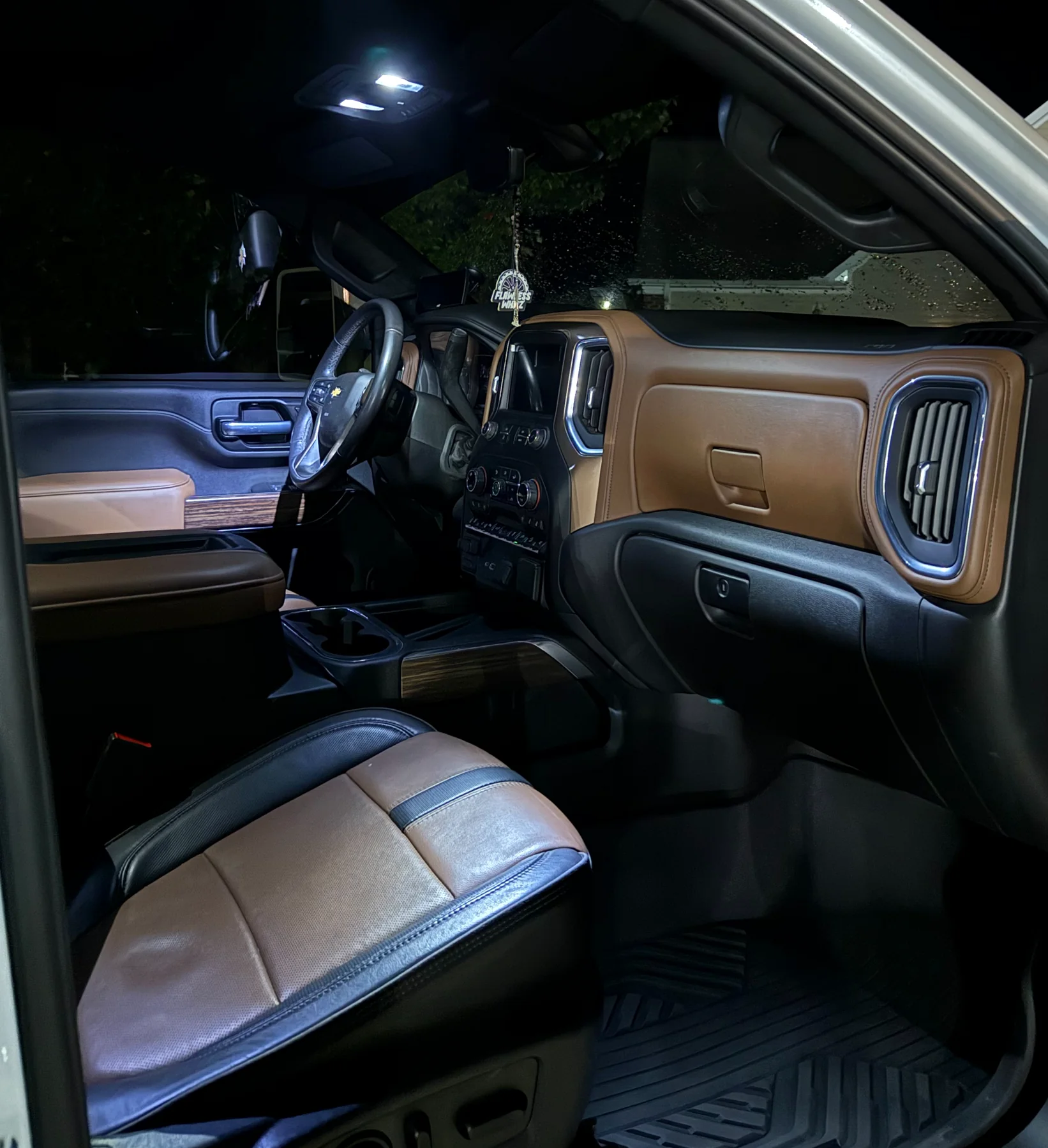 Clean tan leather interior inside a Chevrolet truck
